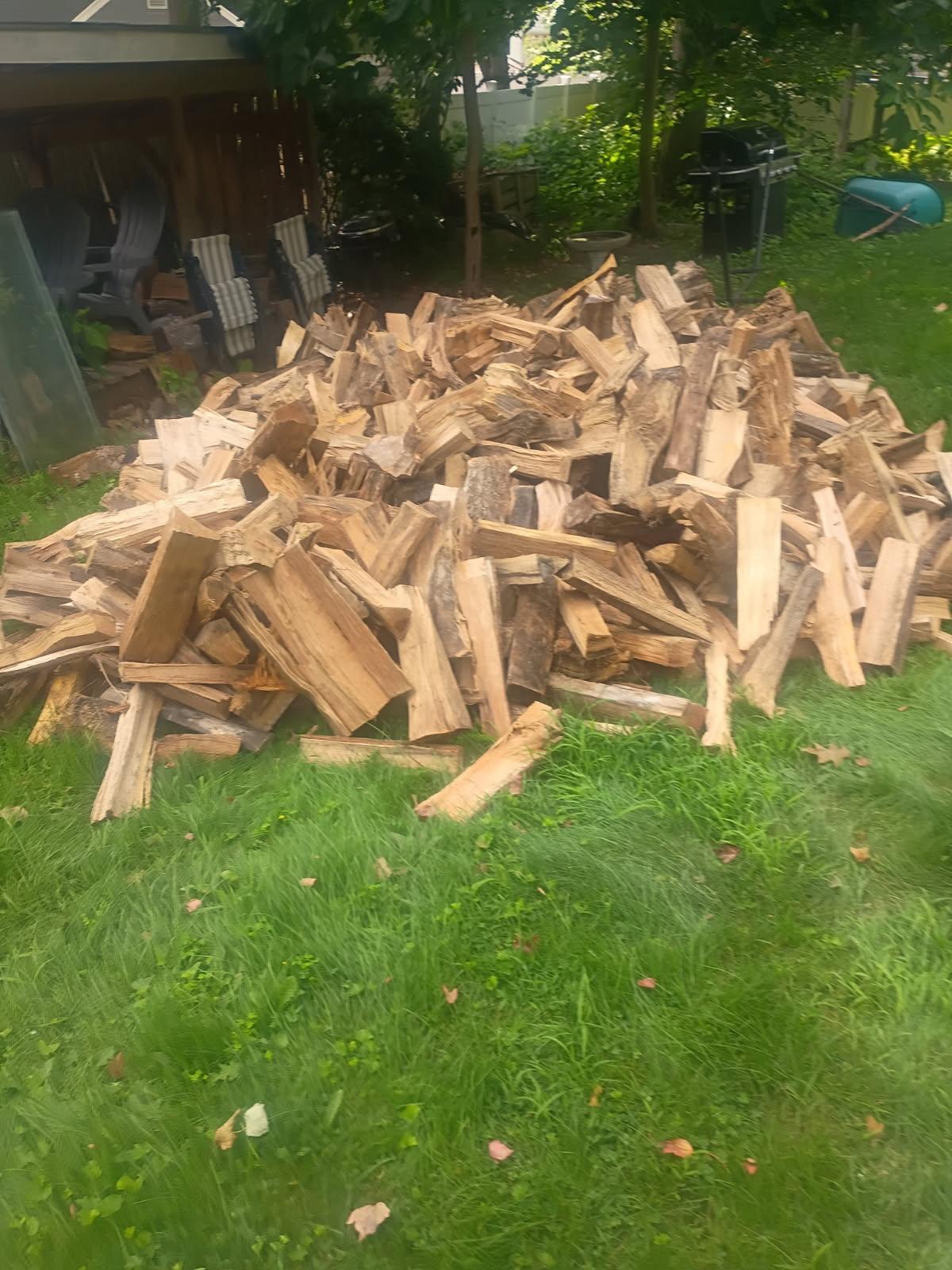 Split firewood stacked on a delivery trailer