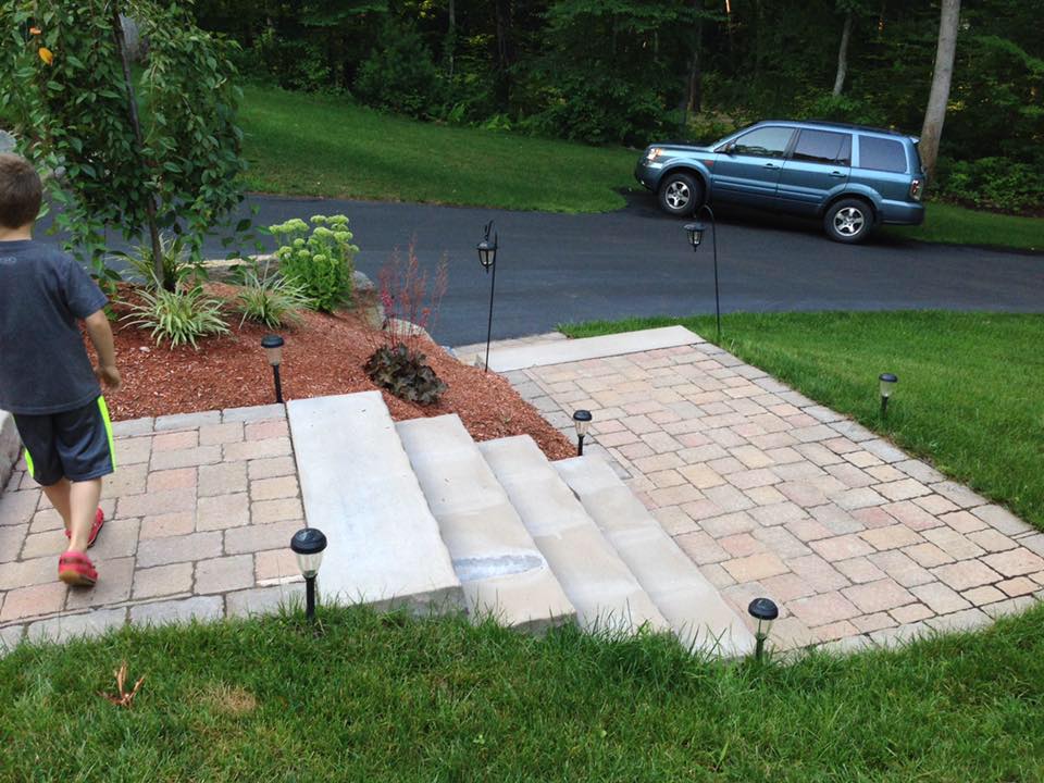 Front entrance paver steps with landscape lighting